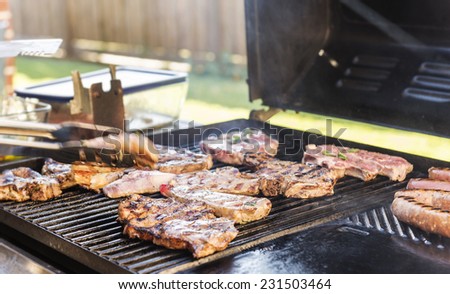 Lamb being grilled on the BBQ at an Australian barbeque outdoor dinner