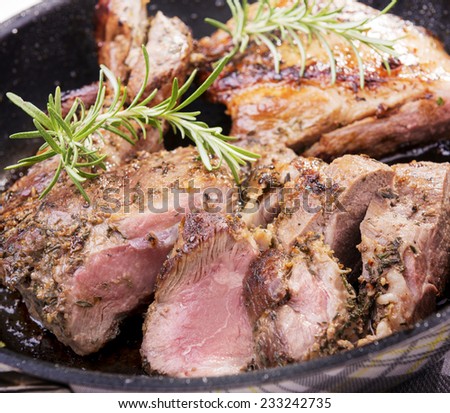 Rustic roast lamb with pan juices and rosemary