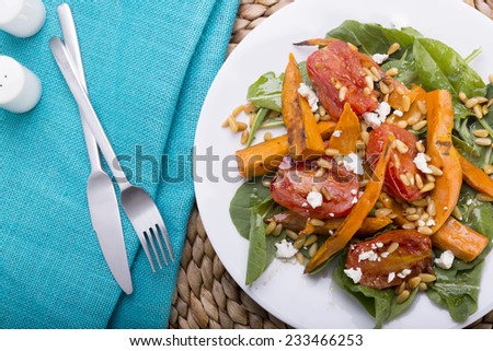 Roast pumpkin salad with tomatoe, pine nuts, feta and dressing, all gluten free