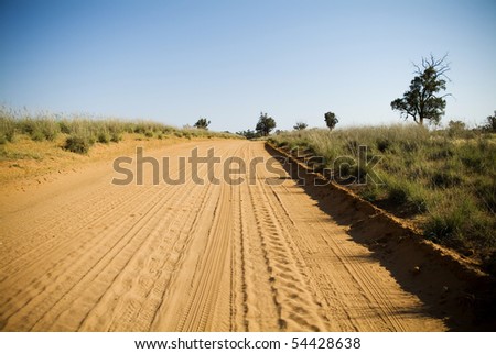 Dry and dusty red dirt road in rural Australia.