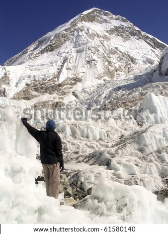 Hiker stands in the Khumbu Icefield at the basecamp of Mt Everest, Nepal.
