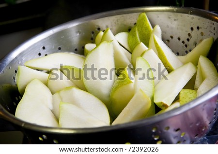 Cut pears in a colander after being washed
