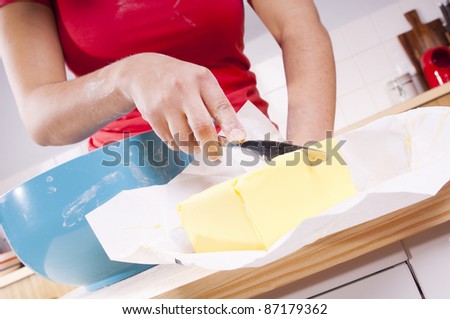 Series of a woman cooking in the kitchen with bright bowls, cutting butter