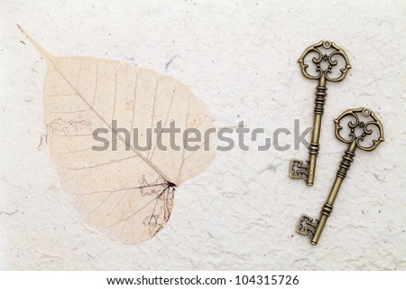 Antique key on handmade rice paper