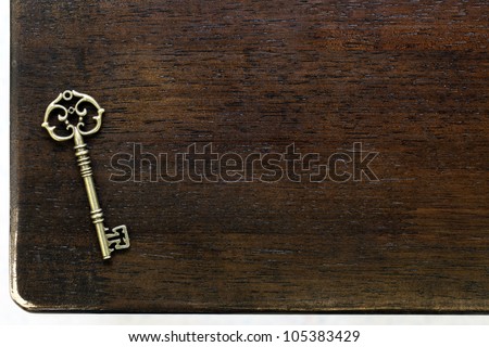 Antique key on wooden table