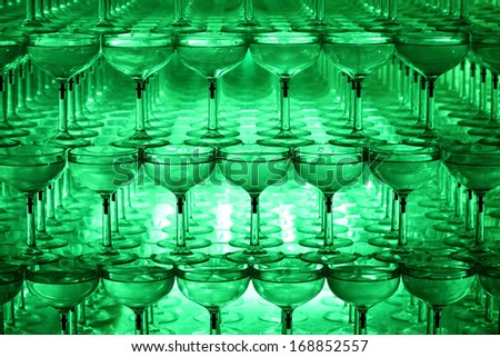 Illuminated champagne glass tower at night, background