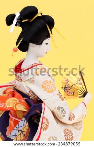 Traditional Japanese geisha doll side view