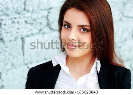 Portrait of a young happy businesswoman in formal cloths