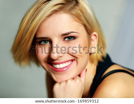 Closeup portrait of a young smiling woman