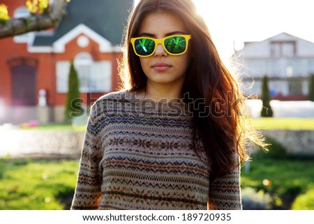Portrait of a beautiful woman in fashionable sunglasses