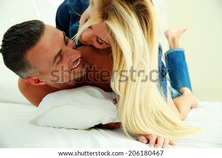 Young love couple in bed, romantic scene in bedroom