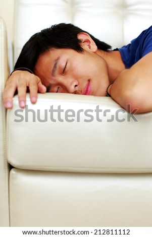 Portrait of a man sleeping on the sofa