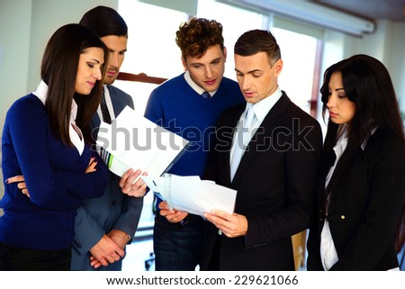 Business people reading a document together