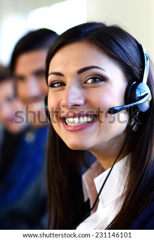 Happy young businesspeople and colleagues in a call center office