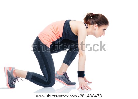 Side view portrait of a runner sporty woman in start position isolated on a white background