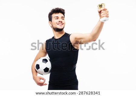Football player holding winners cup isolated on a white background