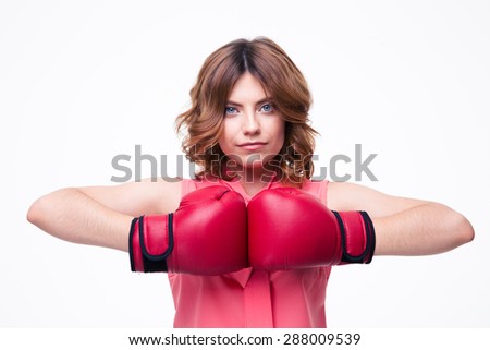 Cute elegant woman with boxing gloves isolated on a white background. Looking at camera