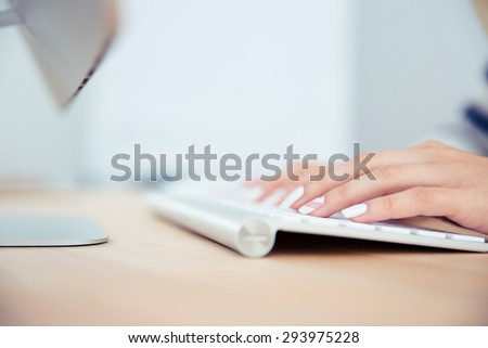 Closeup portrait of a female hands using keyboard
