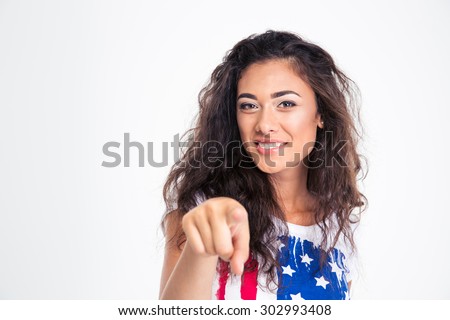 Happy teen girl pointing finger at camera isolated on a white background