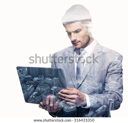 Double exposure of a businessman and a city using a laptop