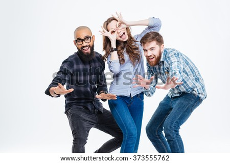 Group of students in casual clothes laughing and having fun