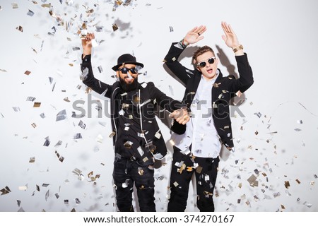 Two young men dancing on party