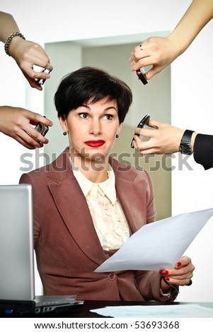Business woman with lots of incoming calls