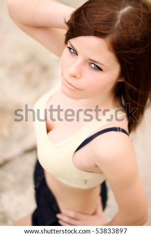 Portrait of a beautiful girl with bright blue eyes. View from above. Focus on eyes