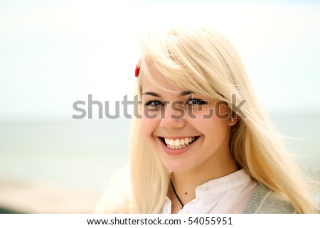 stock photo pretty blond teen girl smiling closeup