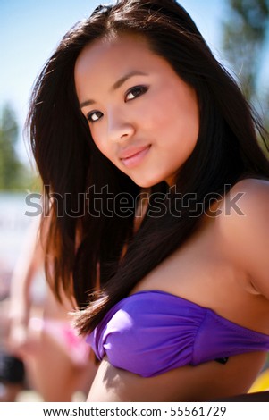 stock photo Closeup portrait of a young asian model in swimwear on the 