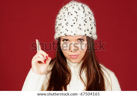 young woman paying your attention isolated on red background