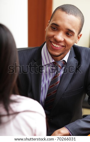 Two business partners having a conversation and laughing