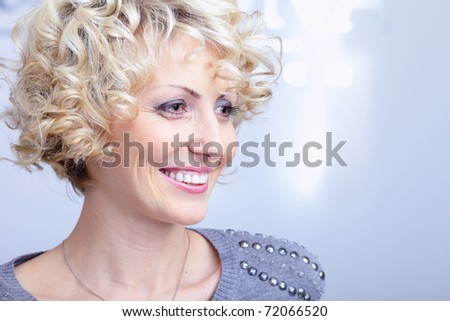 Smiling face of a middle-aged blonde pretty woman