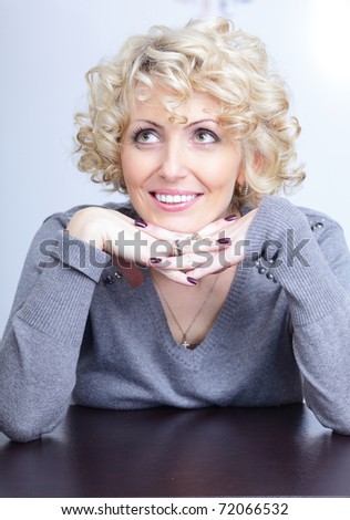 Smiling face of a middle-aged blonde pretty woman