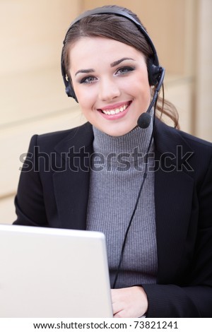 Beautiful call center operator with headset.
