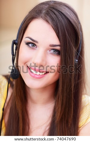 Portrait of a happy young woman in headset