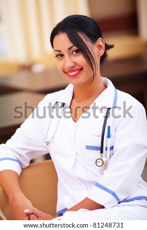 Medical latin doctor woman smiling indoors