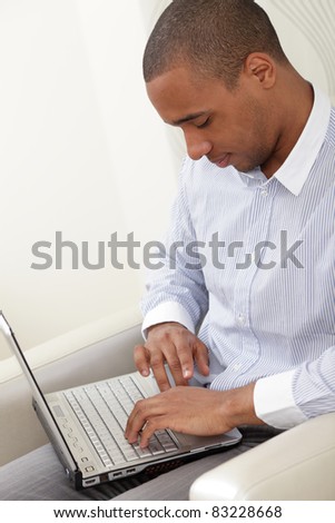 Photo of handsome employee working in office with laptop in front