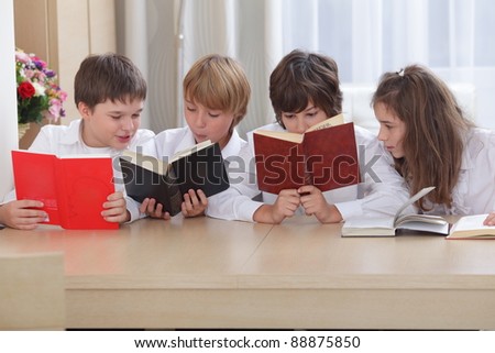 Group of pupils, each of them reading books