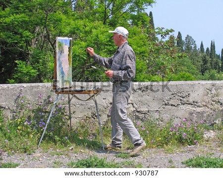 The artist draws a landscape