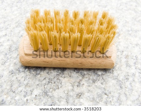 Wooden brush for cleaning on a marble table