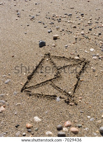 The envelope with the letter is drawn on wet sea sand