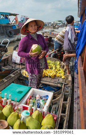 CAN THO, VIETNAM-JANUARY 24: Women selling goods from a boat on the floating market in the Mekong River, Vietnam in January 24, 2014.