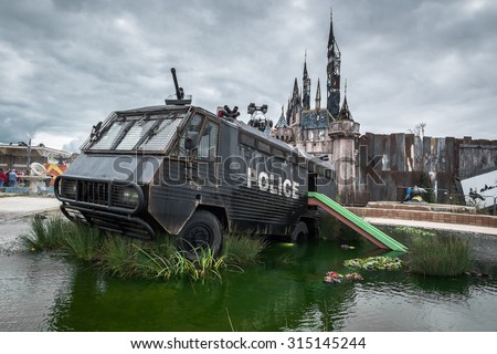 WESTON-SUPER-MARE, UK - SEPTEMBER 3 2015: A police riot van in Water Cannon Creek at Banksy\'s Dismaland Bemusement Park. A five week show in the seaside town of Weston-Super-Mare.