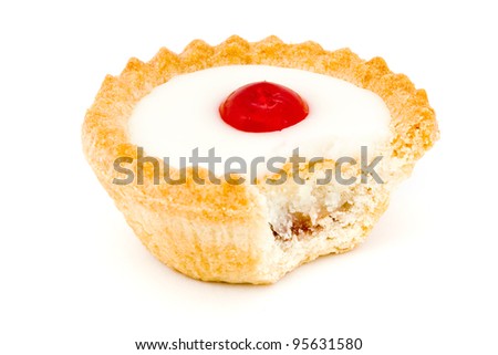 Bakewell tart with a missing bite over white