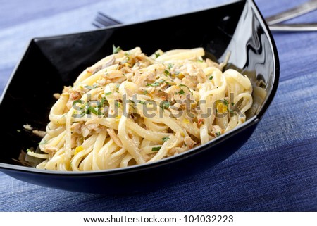 Spaghetti with Creamy Meat on a Black Plate