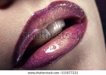 Closeup shot of woman lips with glitter