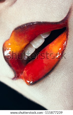 Closeup shot of woman lips with creative makeup