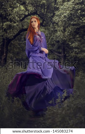 Woman in lilac dress. Outdoors fashion shot