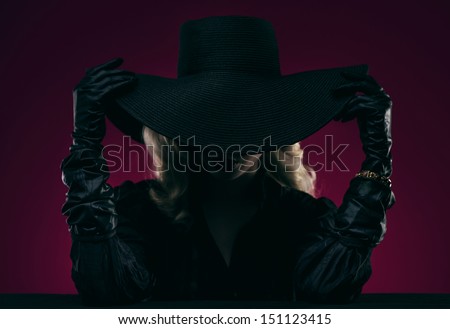 Elegant woman in black hat